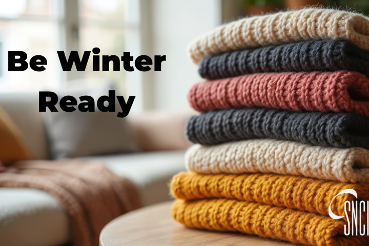 Stack of sweaters next to the words: Be Winter Ready